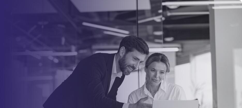 Two people looking at a computer